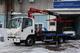 Эвакуатор с ломаной платформой на базе ISUZU ELF 7.5 (NPR75L) с КМУ